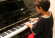 Jonathan learning some songs in a piano lesson in san jose!